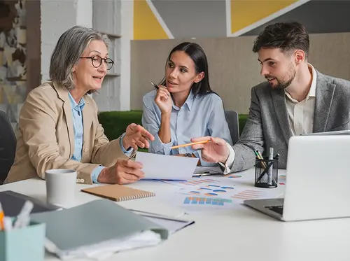 Three people in a meeting