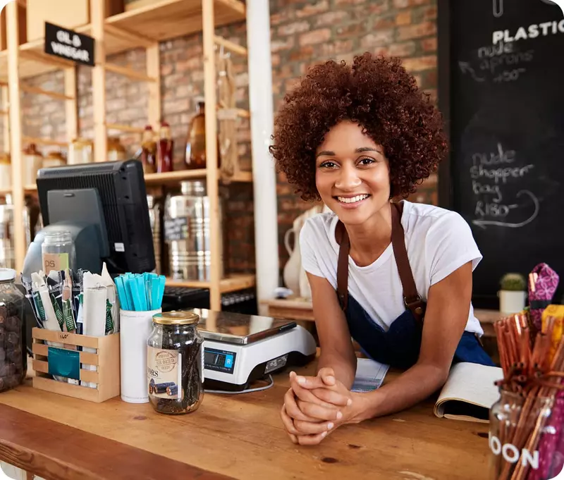 Woman behind cafe counter