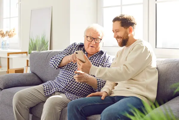 Two men looking at a mobile app