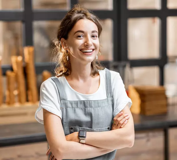 Woman in warehouse on phone