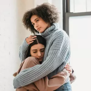 Two women hugging