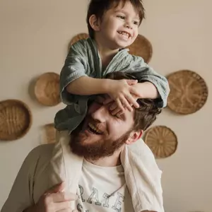 Man with boy on shoulders