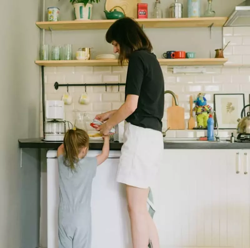 Woman and little girl in kitchen