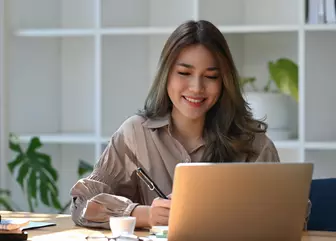 Laptop resting on books