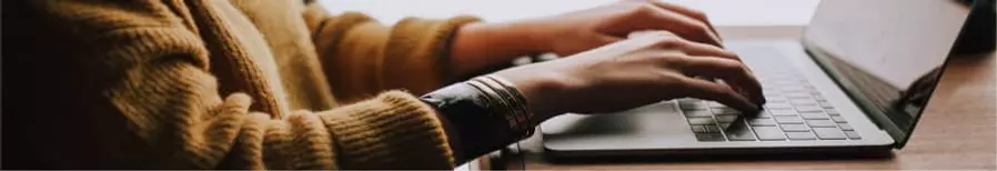 Person typing on laptop